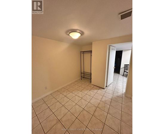A room with a tiled floor and a sliding door.
