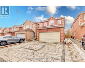 A Royal LePage real estate brokerage is advertising a property with a brick house and a garage.