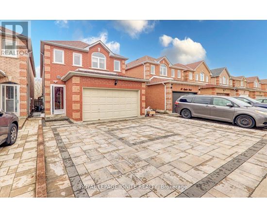 A house with a garage and a car parked in front.