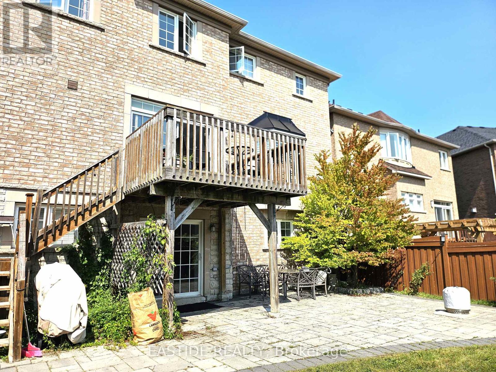 A house with a balcony and a patio.