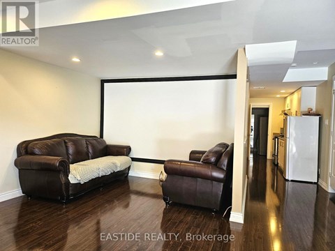 A living room with a couch and a chair.