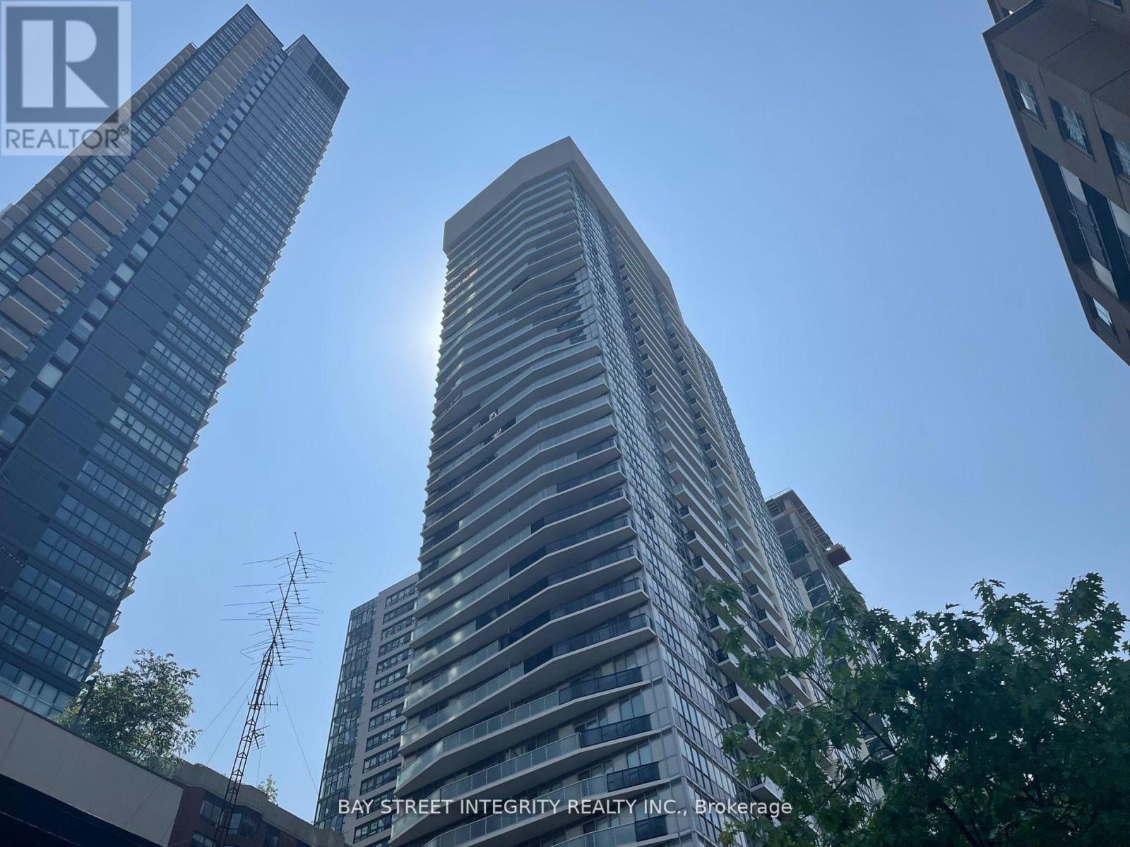 A tall building with the Bay Street Integrity Realty Inc. logo on it.