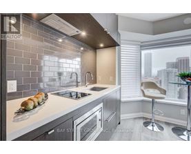 A modern kitchen with a view of the city.