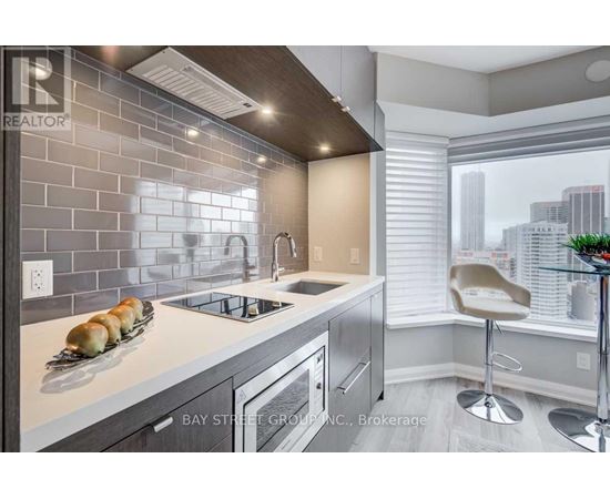 A modern kitchen with a view of the city.