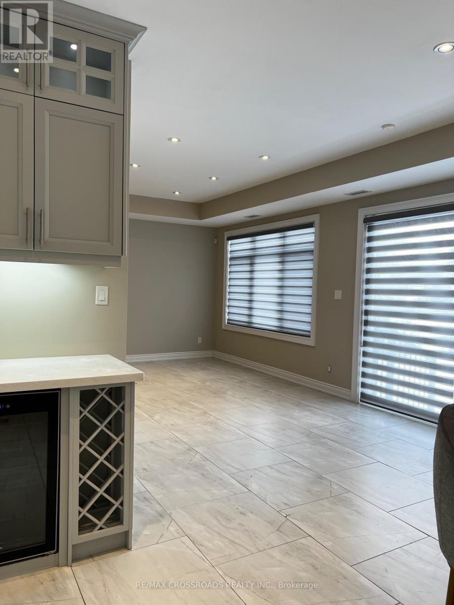 A kitchen with a wine cooler and a counter top.