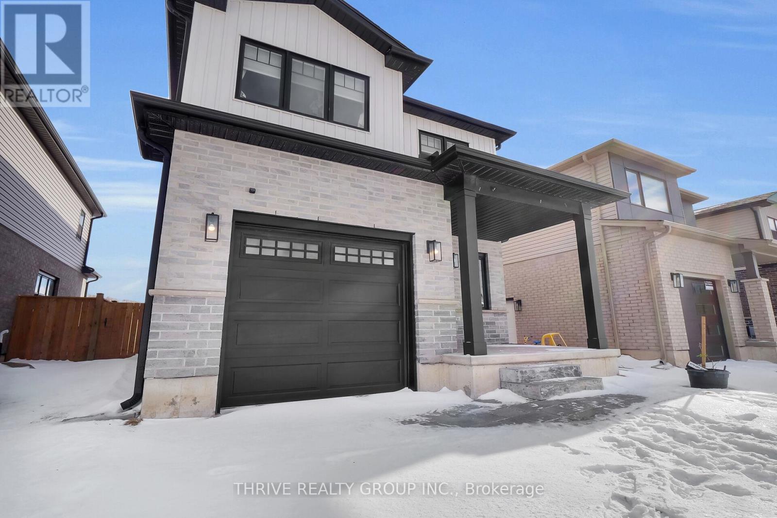 A house with a garage is for sale by Thrive Realty Group Inc. in Brokerage.