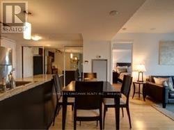 A dining room with a table and chairs is shown.