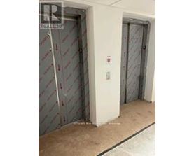 A white door with a red sign on it.
