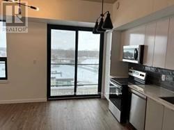 A kitchen with a microwave on the counter.