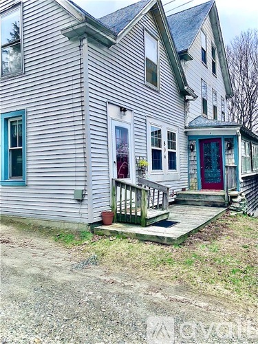 A house with a blue door and a red door.