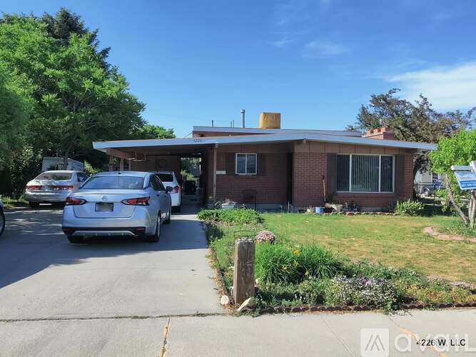 A house with a car parked in front of it.