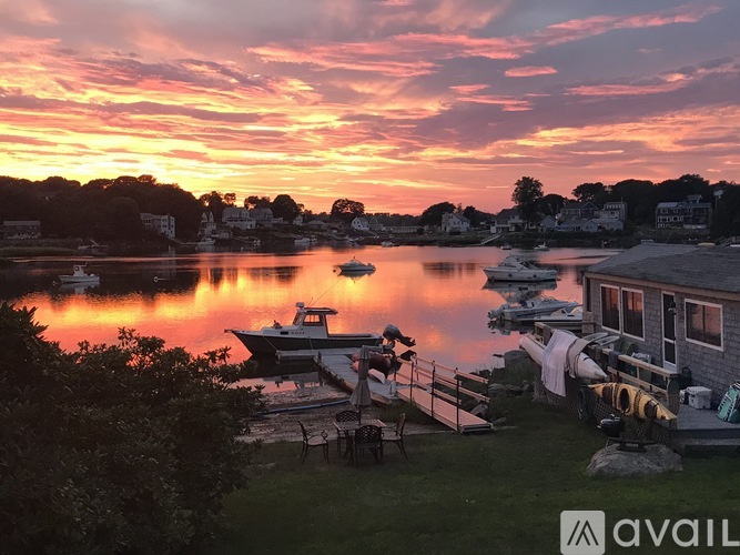A beautiful sunset view of a marina with boats docked.