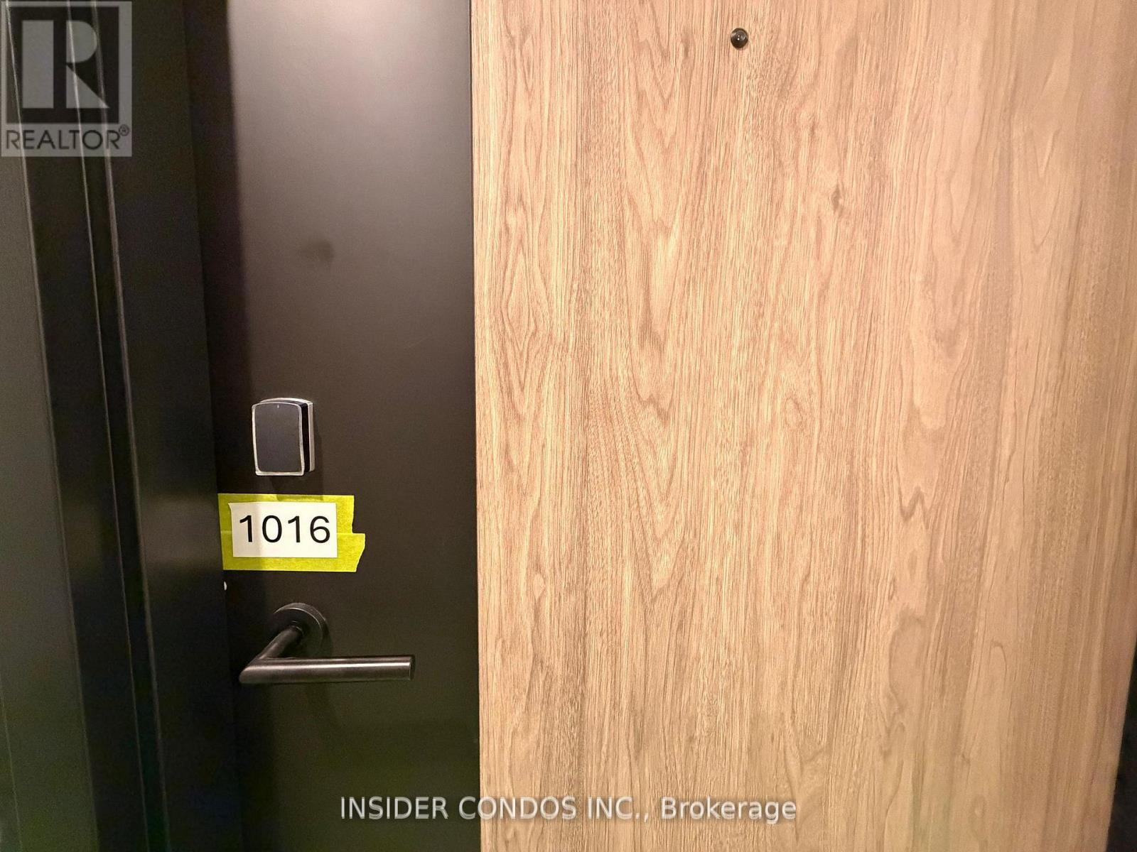 A door with a number 1016 on it.