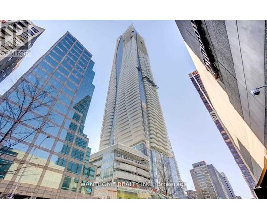 A tall building with the words "WANTHOME REALTY INC. Brokerage" on its facade stands in a cityscape.