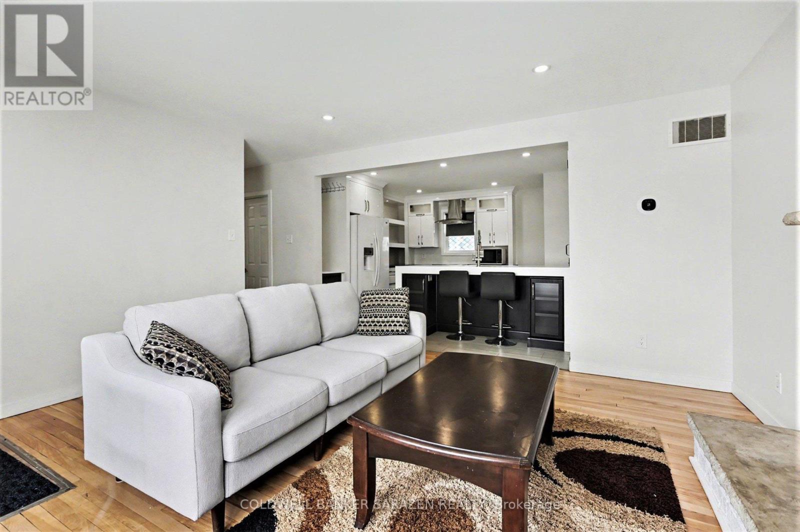A modern living room with a white couch and a coffee table.