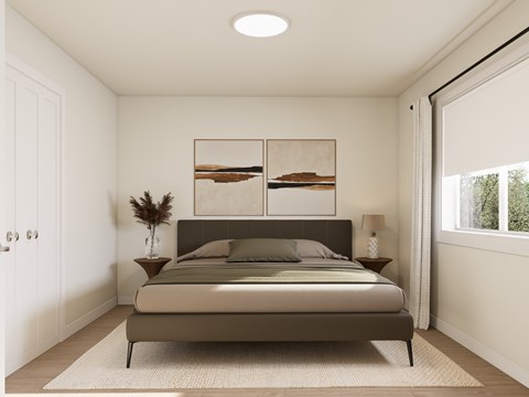 A bedroom with a bed, a plant, and a painting on the wall.