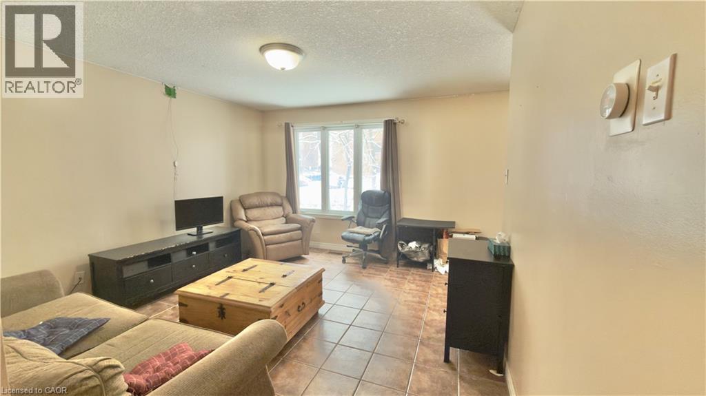 A living room with a brown couch and a wooden coffee table.