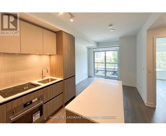 A kitchen with wooden cabinets and a stove top oven.