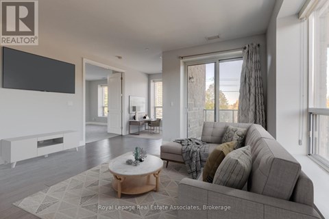 A modern living room with a grey sofa and a wooden coffee table.