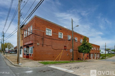 A red brick building with a sign that says "Pamela's" on it.