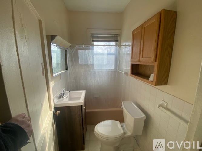 A room with a carpeted floor and white walls.