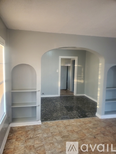 A room with a marble floor and white walls with a logo that says "avaiL".