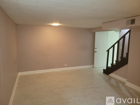 A room with a window and a ceiling fan.