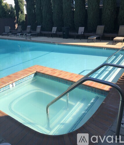 A pool with a ladder in the middle of it.