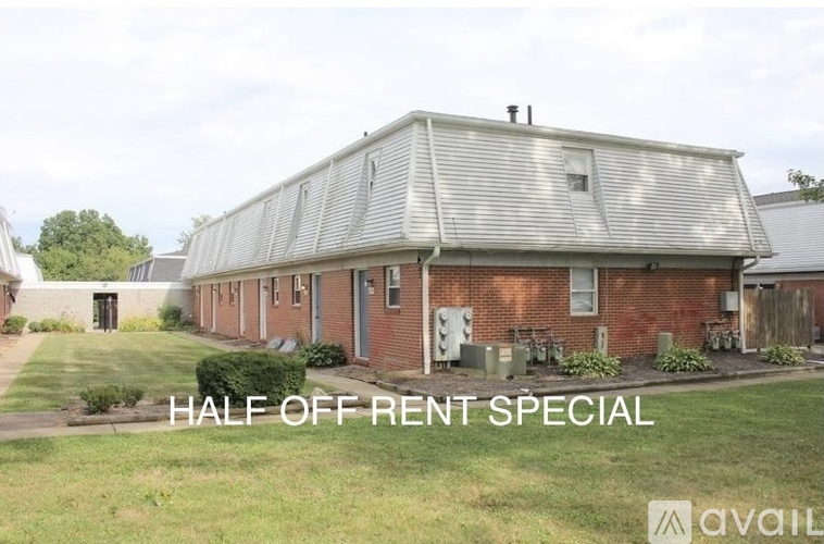 A house with the text "HALF OFF RENT SPECIAL" in front of it.