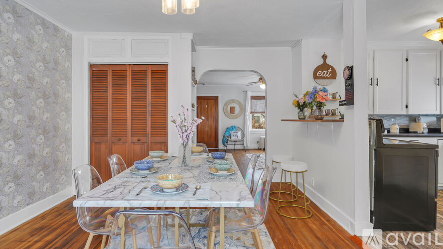 A kitchen with a table set for a meal.