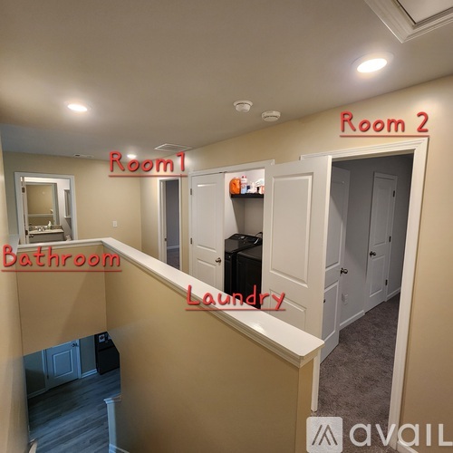 A room with a bathroom and laundry area is labeled as Room 1 and Room 2.
