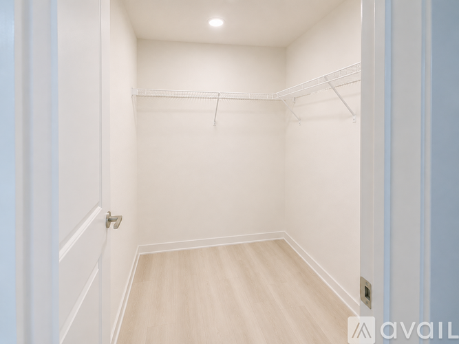 A room with a window and a door.
