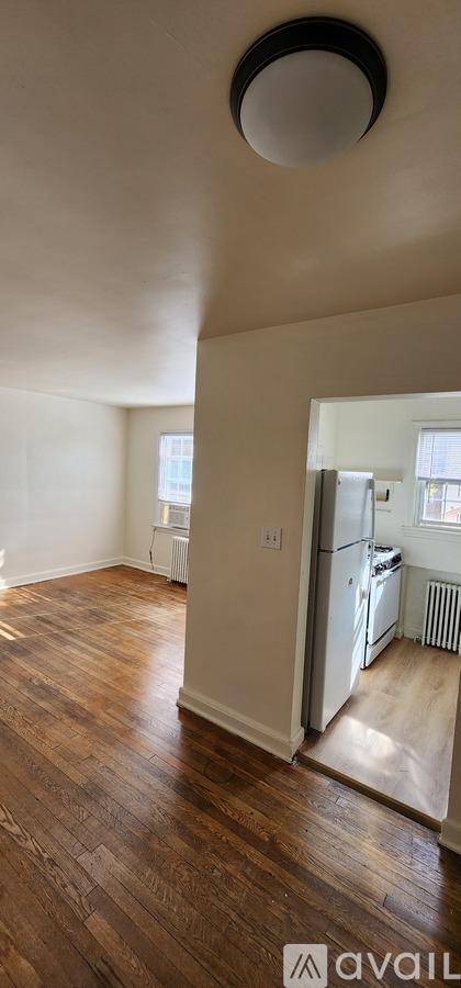 A room with wooden floors and a white ceiling.