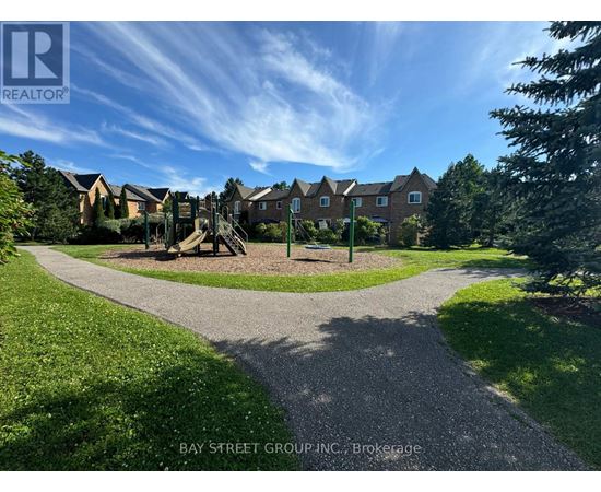 A residential area with houses and a playground.