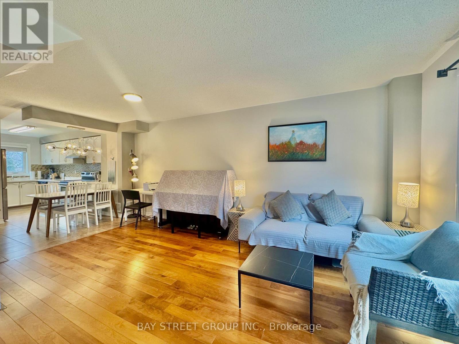 A living room with a couch, chair, and a coffee table.
