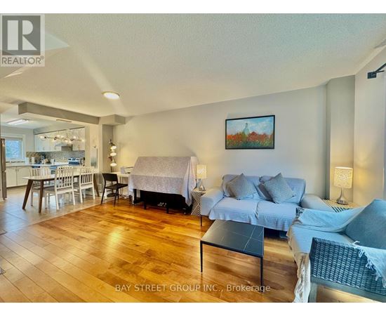 A living room with a couch, chair, and a coffee table.