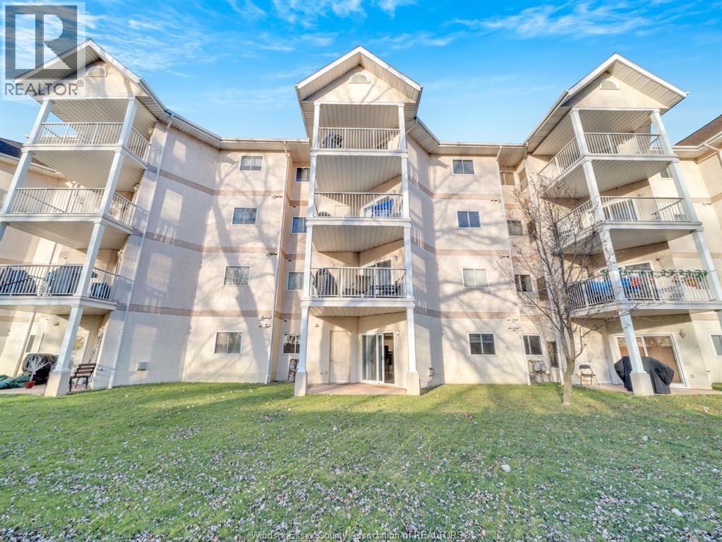 A large apartment complex with multiple balconies and doors.