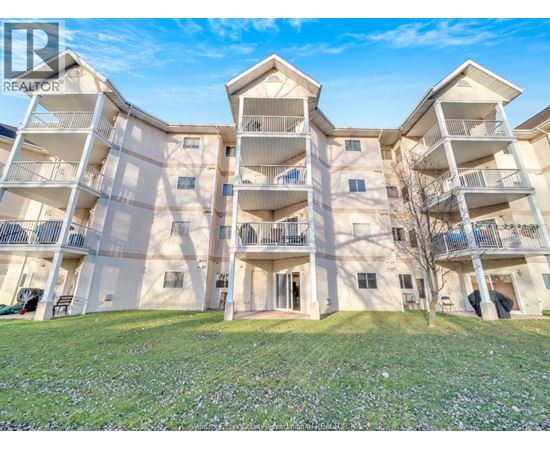 A large apartment complex with multiple balconies and doors.
