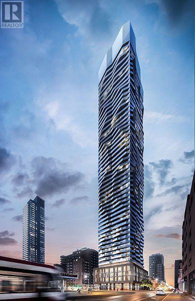 A tall, modern skyscraper stands in the center of a bustling city street.