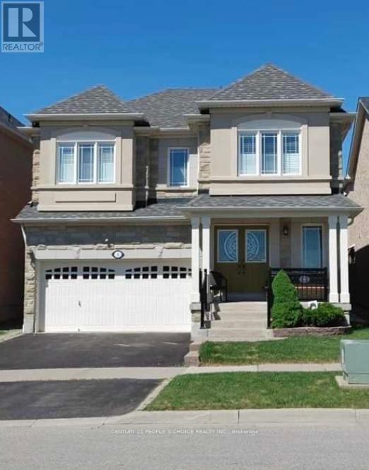 A two-story house with a garage is for sale.