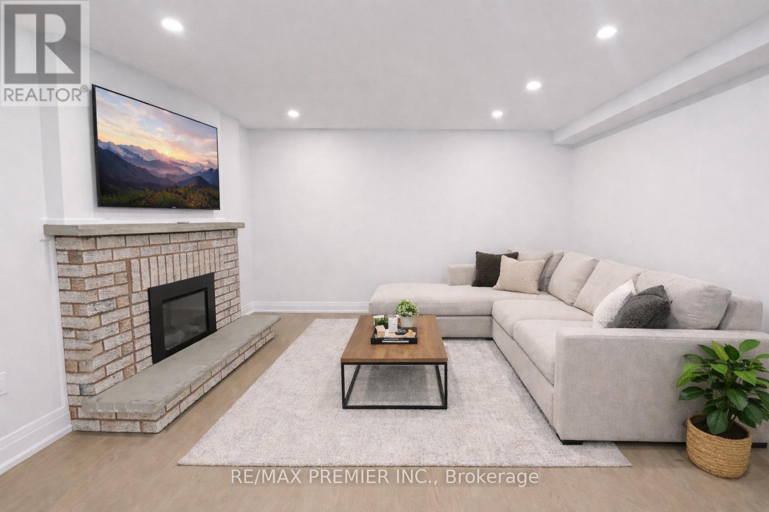 A living room with a fireplace and a couch.