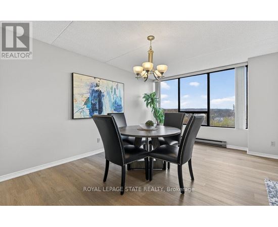 A dining room with a table set for four.