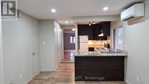 A kitchen with a counter top and cabinets.
