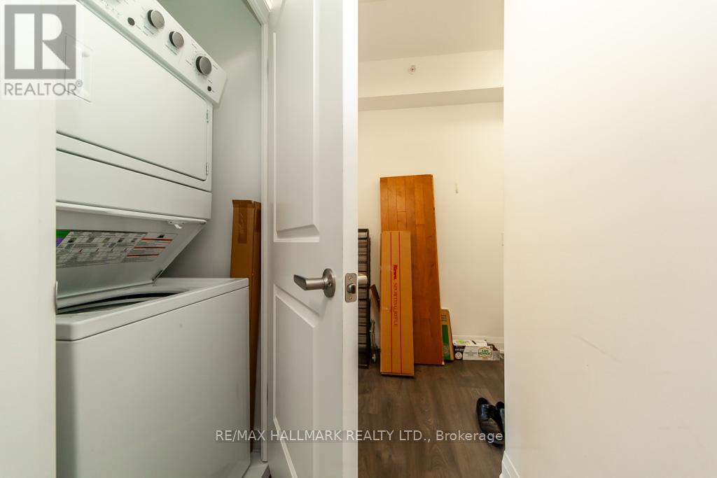 A white oven and dishwasher in a kitchen with a door open.