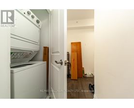 A white oven and dishwasher in a kitchen with a door open.