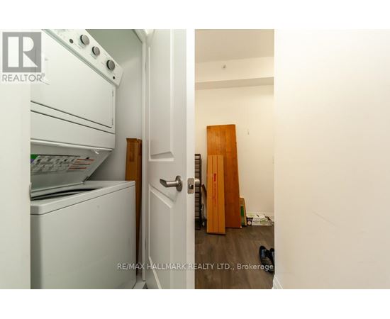A white oven and dishwasher in a kitchen with a door open.