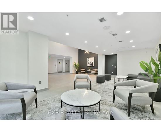 A modern living room with grey furniture and a marble table.