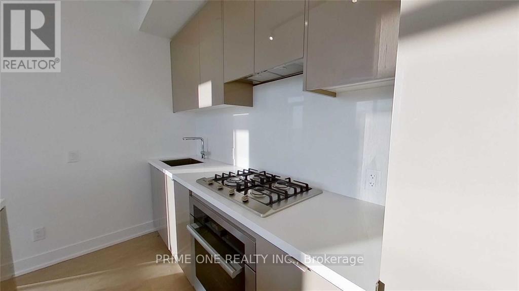 A modern kitchen with a white stove top oven.