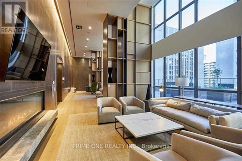 A modern living room with a long couch and a coffee table.