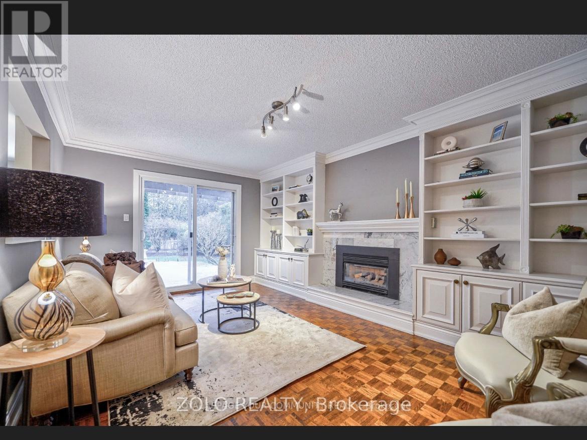 A living room with a fireplace and a couch.